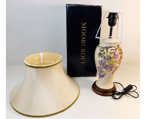 A boxed Moorcroft pottery lamp, unused with shade 22in high inclusive
