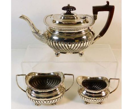 A Birmingham Victorian silver matched tea service, teapot Barker Bros. 1898 &amp; creamer &amp; sugar bowl Joseph Gloster 189