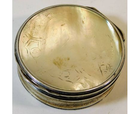 A white metal mounted mother of pearl box with erotica carved under the lid 