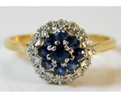 An 18ct gold ring with platinum mounted diamond &amp; sapphire 4g size Q/R