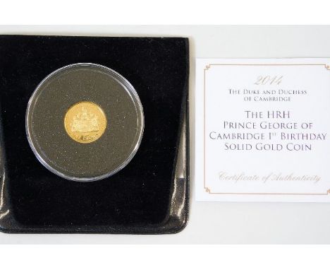 A gold proof coin commemorating first birthday of Royal baby 