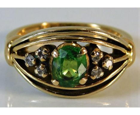 An 18ct gold ring set with tsavorite &amp; diamond 5.6g size K