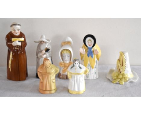 ROYAL WORCESTER; a collection of seven assorted candle snuffers, including French cook, young girl, and a blush ivory example