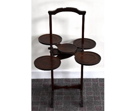 'THE MONOPLANE'; a patent mahogany folding cake stand set with dished platforms, height 78cm.Additional InformationGeneral li