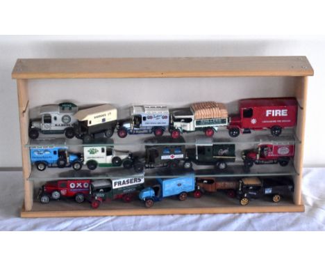 A modern small table top display case containing fifteen tin plate vehicles, including Corgi Lincolshire Fire Brigade truck, 
