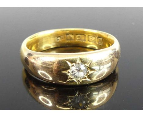 A 22ct gold band ring, gypsy set with an old round cut diamond weighing approx 0.15ct, sponsor SH, Birmingham 1927, size N, 6