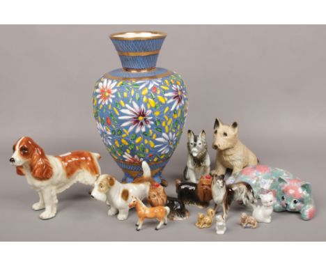 A Belgian enameled pottery vase and a collection of ceramic animals including cooper craft and Wade whimsies etc. 
