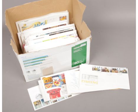A box of British Post Office and Royal Mail first day covers. 