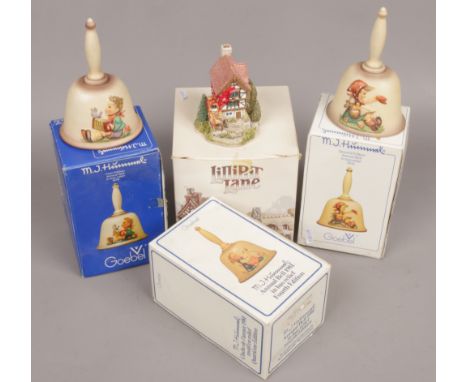 Three boxed Goebel Hummel annual bells including a first edition, along with a boxed Lilliput Lane cottage, four seasons. 