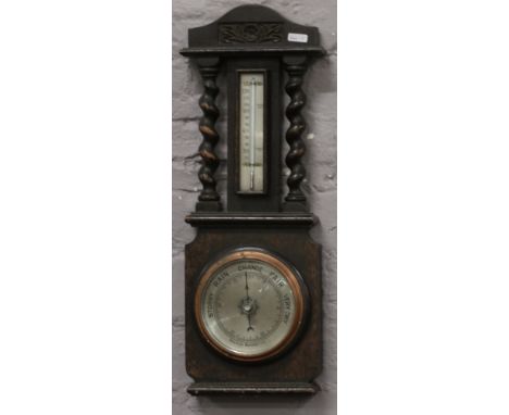 An oak Aneroid wall barometer. 