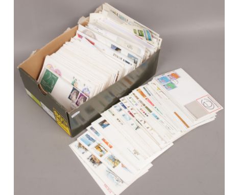 A box of Royal Mail and Post Office first day covers. 