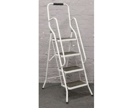 A set of white aluminium step ladders. 