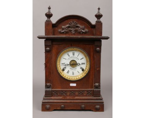 A Fattorini &amp; Sons Bradford wooden cased alarm mantle clock 