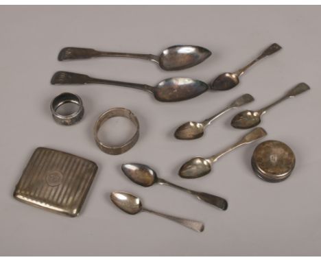 A collection of hallmarked silver to include cigarette case, serving and tea spoons, napkin rings and bangle etc, 404 grams. 