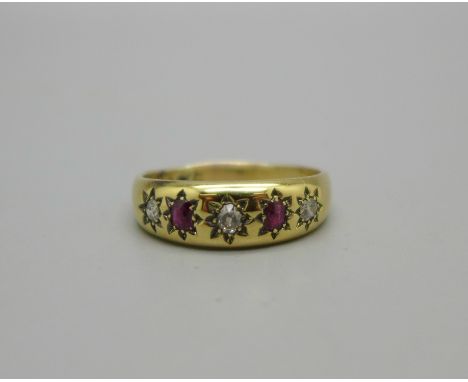 A vintage yellow metal ruby and diamond ring stamped 18ct in the shank, 5.1g, U 