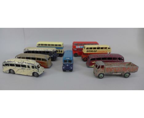 Nine die-cast model vehicles including a Dinky Toys Dunlop bus and four other Dinky Toys buses 