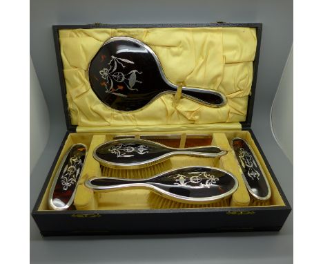 A tortoiseshell and silver piquet six piece dressing set, London 1925, all original including the comb, complete with fitted 