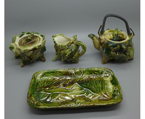A 'Shell' majolica ceramic tea service with teapot, cream, sugar and tray 