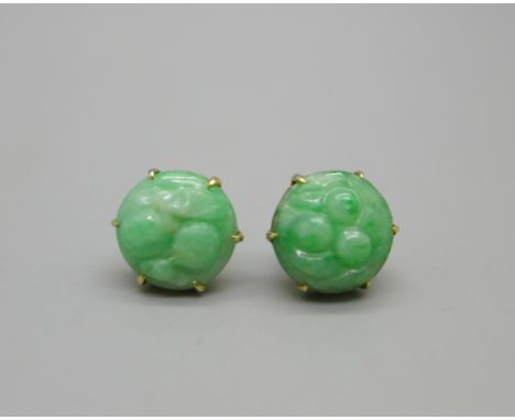 A pair of carved jade earrings, the butterflies marked 9ct 
