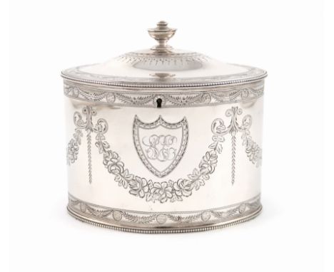 A George III silver tea caddy, by John Harris, London 1786, oval form, engraved foliate decoration and with swags and garland