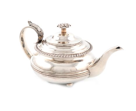 λA George IV silver teapot, by Burrows and Pearce, London 1826, circular form, leaf capped scroll handle with ivory insulator