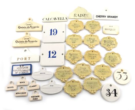 A collection of ceramic bin labels, various dates, including a set of thirteen French labels, plus some with numbers, plus 'C