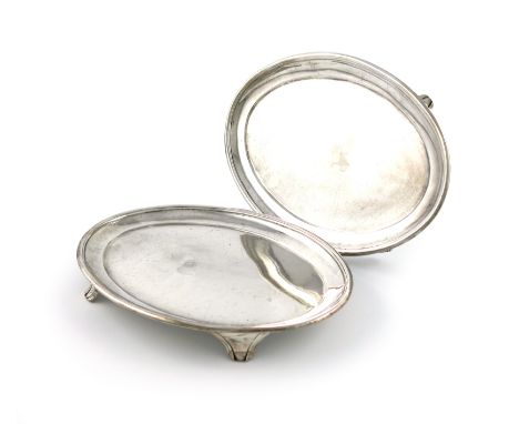 A pair of George III silver teapot stands, by Solomon Hougham, marks worn, plain oval form, moulded borders, on four bracket 