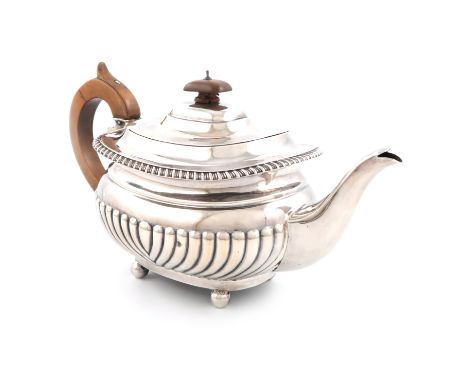 A Victorian silver teapot, by The Barnards, London 1895, rounded rectangular form, part-fluted decoration, scroll handle, gad