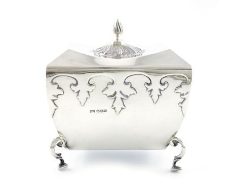 A silver tea caddy, by James Dixon and Sons, Sheffield 1924, tapering rectangular form, cut-card decoration, the hinged cover