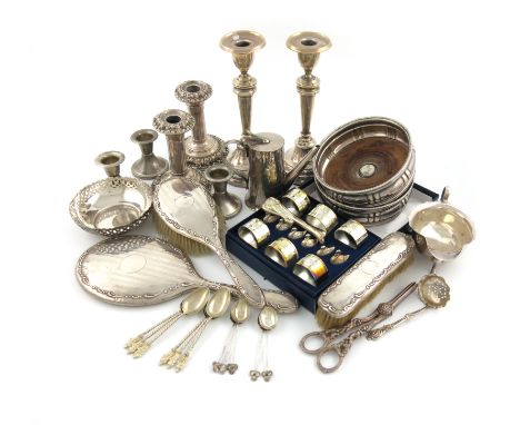 A mixed lot, comprising silver items: a sauce boat, a pair of candlesticks, another smaller pair of candlesticks, embossed de