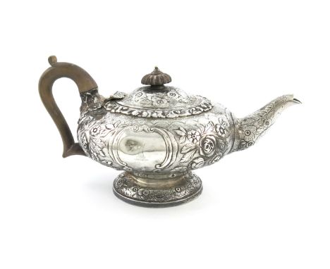 A George IV silver teapot, by Joseph Hodgson, London 1828, compressed circular form, chased foliate decoration, wooden scroll