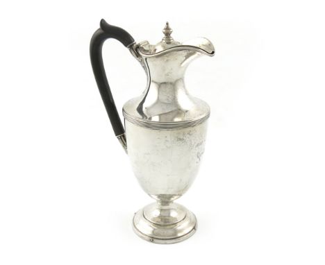 An Edwardian silver hot water pot, by H. Woodward and Co, London 1906, vase form, scroll handle, domed hinged cover with a kn