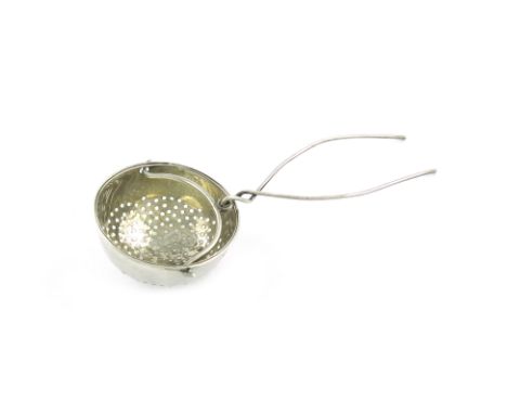 A George III silver tea strainer, by Phipps and Robinson, circular form, pierced body, with a hinged handle and wirework spik