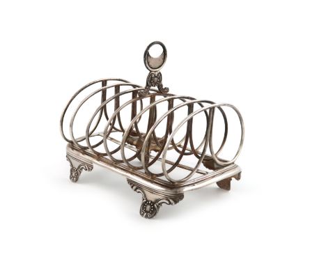 A William IV silver seven-bar toast rack, possibly by Charles Fox, London 1831, wire-work bars, central foliate capped ring h