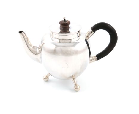A Victorian silver teapot, by Hukin and Heath, Birmingham 1879, in the Christopher Dresser manner, ovoid body, scroll handle,