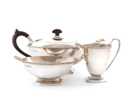 A three-piece Art Deco silver tea set, by The Adie Brothers, Birmingham 1931, shaped rectangular form, plastic scroll handle 