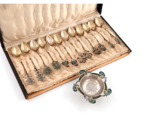 A set of twelve Norwegian silver and enamel teaspoons and a tea strainer, by Marius Hammer, Bergen, (only two spoons and tea 