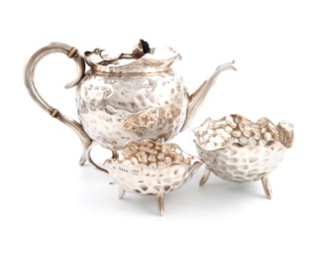 λA matched three-piece Victorian silver tea set, the teapot by Heath and Middleton, London 1885, the cream and sugar by Willi