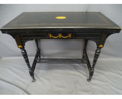 AESTHETIC STYLE EBONIZED &amp; INLAID MAHOGANY CARD TABLE, the castors stamped 'C &amp; C Patent', 74cms H, 89cms W, 46cms D 