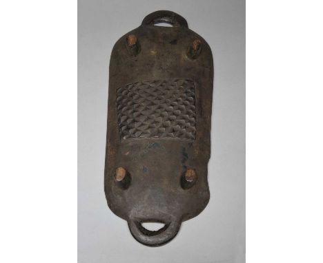A Zulu platterSouth Africathe underside with a relief carved amasumpa panel and four short legs and open end handles, 48cm lo