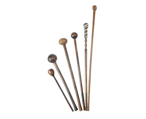 A Zulu knobkerrieSouth Africawith metal tacks to the compressed circular head,76cm long, and five Zulu knobkerries / staffs, 