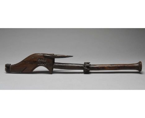 A Mwera axeTanzaniawith a carved antelope head with inset glass bead eyes and carved panels, with a knoped shaft with a band 