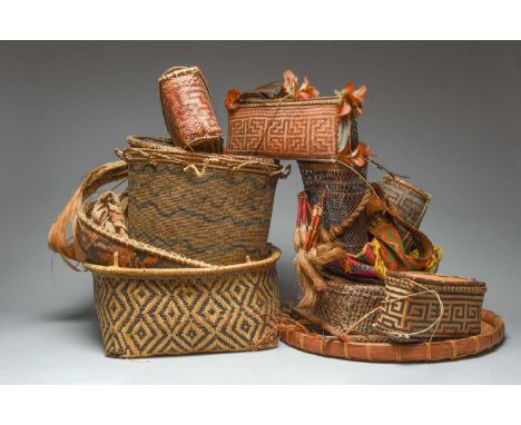 A collection of South American basketry including a Yanomami, Venezuela, women's carrying basket, with painted wavy line deco