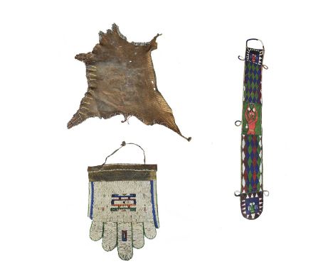 A Ndebele apronSouth Africaleather, cloth and coloured glass beads,59.5cm long, a Surma, Ethiopia hide apron, with striped pi
