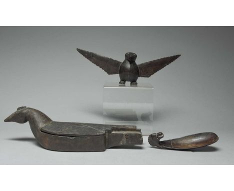 A Timor spoonIndonesiahorn, with a carved head finial,15cm high,an Indonesian wood mortar, carved as a bird with a hinged cov