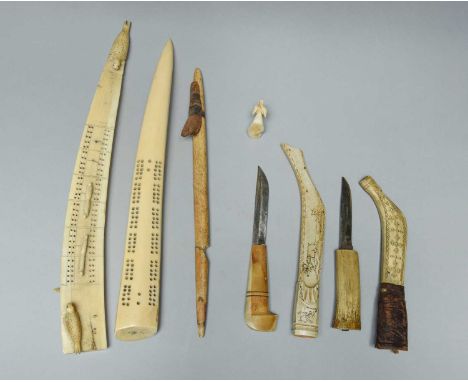 λTwo Sami knives with scabbardsLaplandantler, steel and leather, with incised decoration of a caribou pulling a sleigh and ca