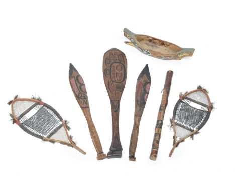 A Haida model paddleCanadacedar and painted an eagle either side, with collection label WI.25, 61cm long,a pair of Northwest 