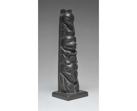 A Haida model totem poleBritish Columbiaargillite, carved a raven, beaver and a whale, the base inscribed #102 S.ARG MADE IN 