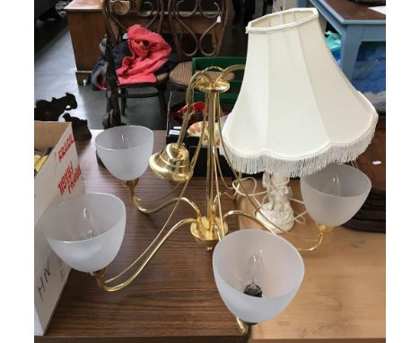 An alabaster figural table lamp, together with a gilt metal six arm chandelier 
