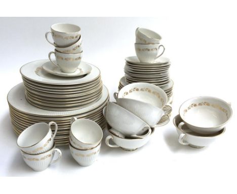 A Royal Doulton 'Fairfax' tea service, white highlighted in gilt, to include cups, saucers, side plates, dinner plates, etc 